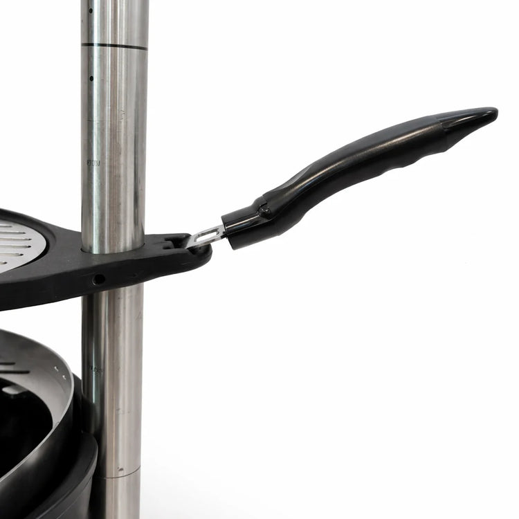 Close-up of a black frying pan with a handle on a white background