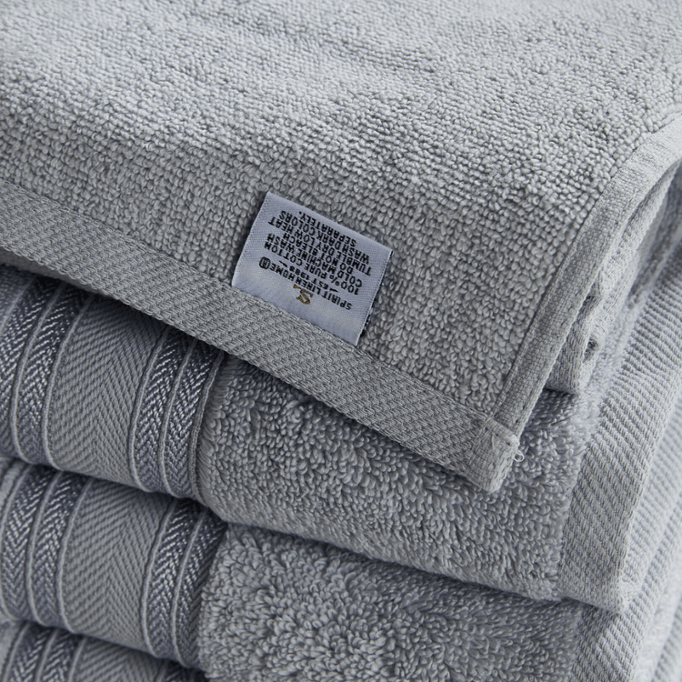 Stack of gray towels with a label on top