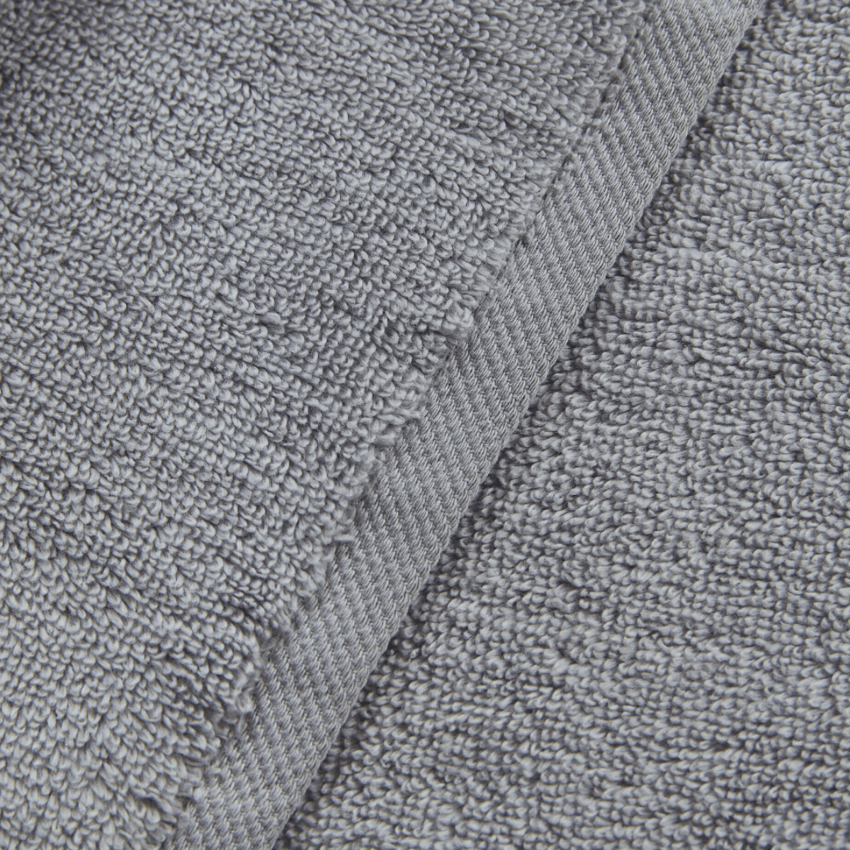 Close-up of gray textured fabric with a focus on texture and pattern.