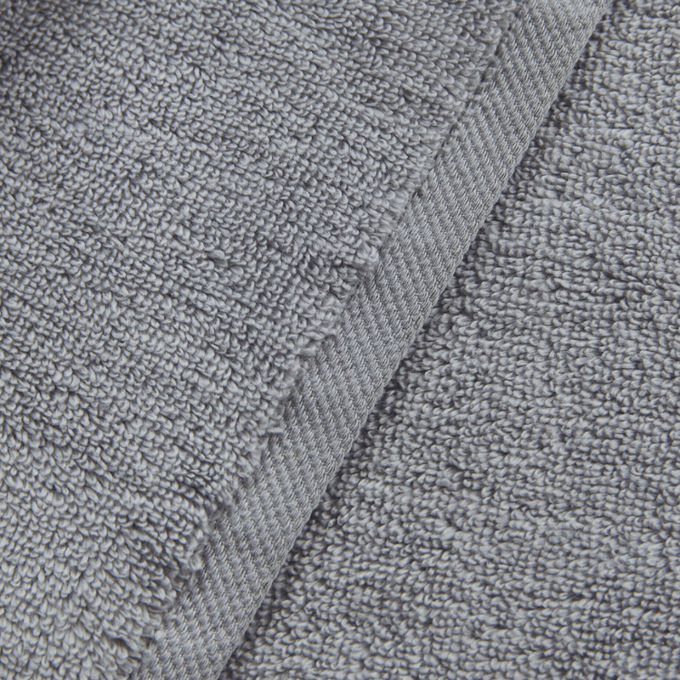 Close-up of gray textured fabric with a focus on texture and pattern.