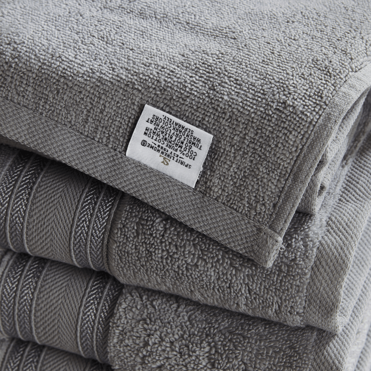 Stack of gray towels with a label on top