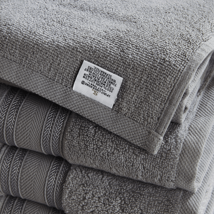 Stack of gray towels with a label on top
