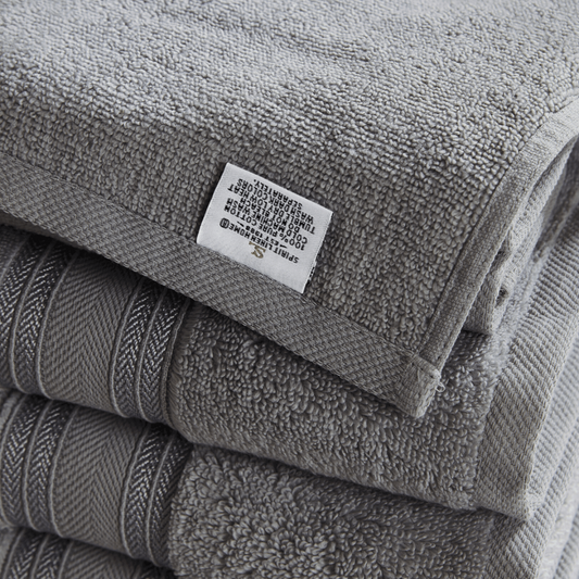Stack of gray towels with a label on top