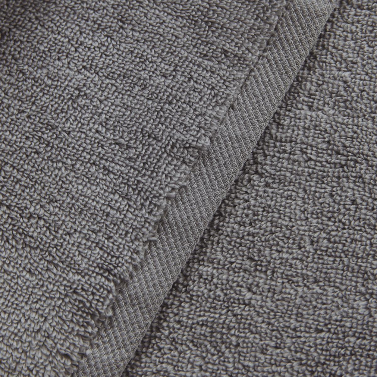 Close-up of gray textured fabric with a focus on texture and pattern.