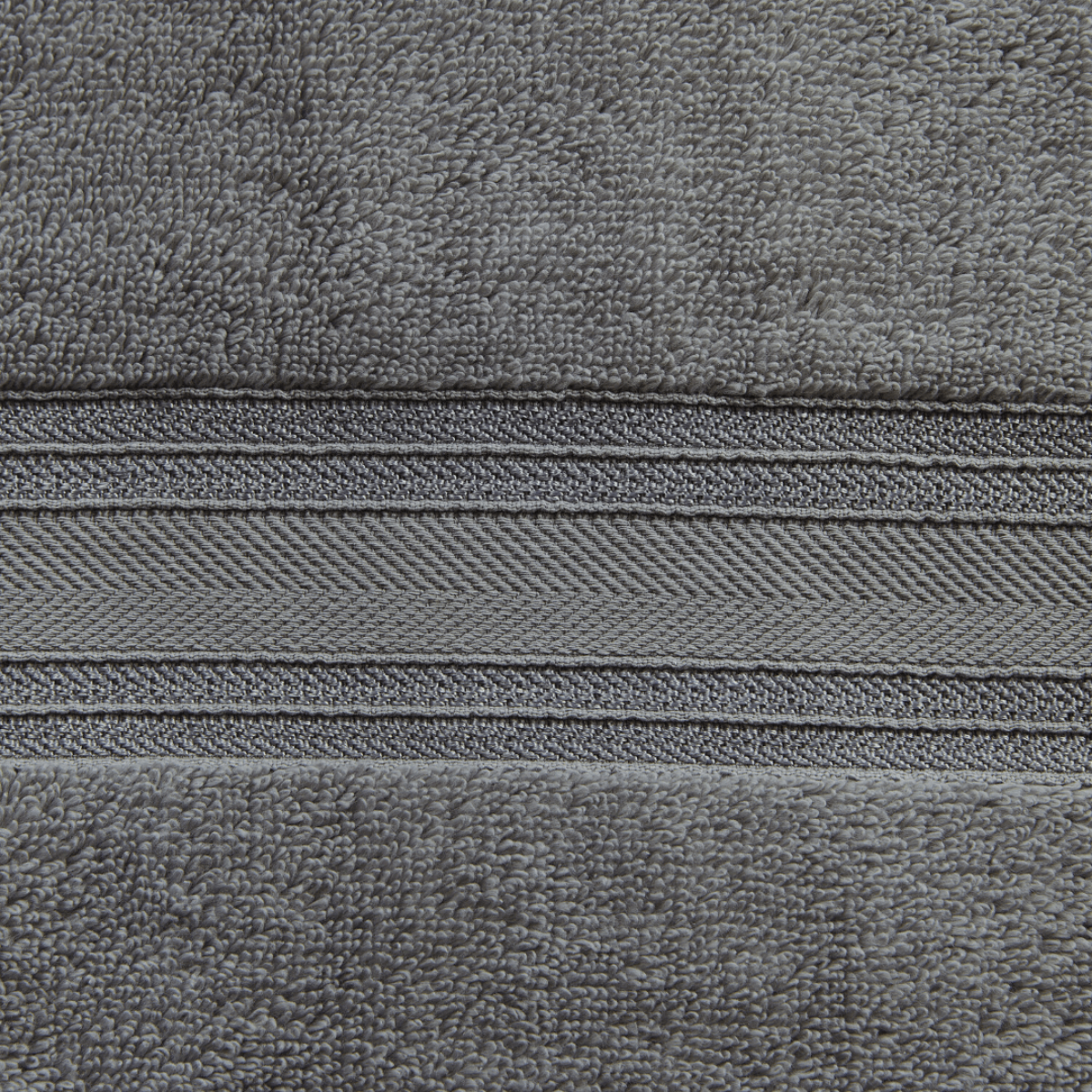 Close-up of gray fabric with a zipper