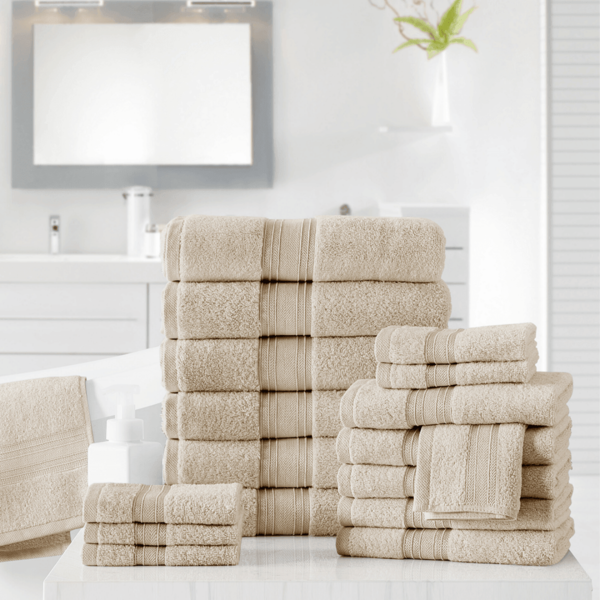 Stack of beige towels on a white surface with a neutral background