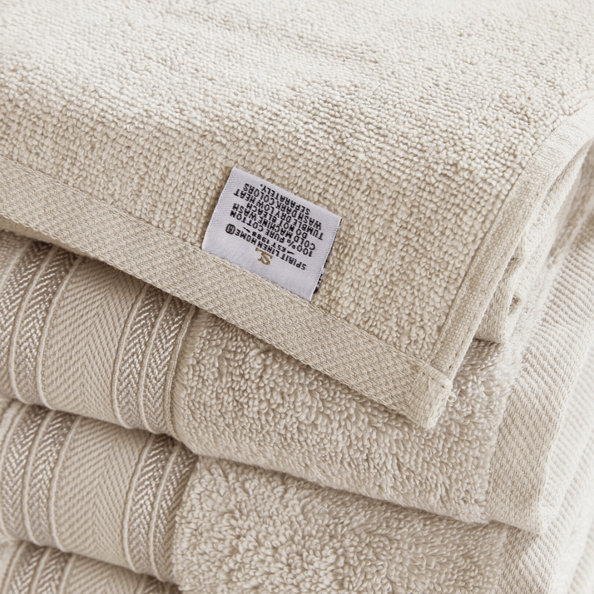 Beige towel with a label on a white background
