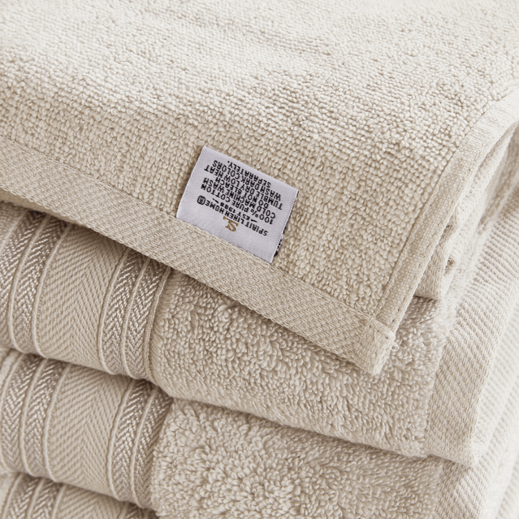 Beige towel with a label on a white background