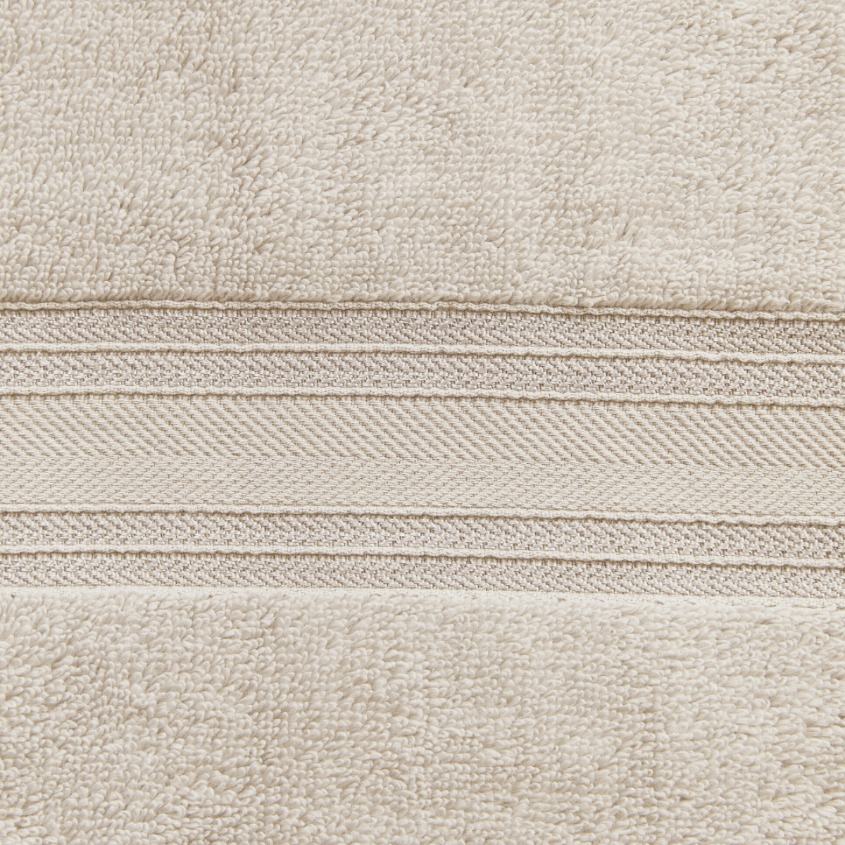 Close-up of beige fabric with a subtle pattern
