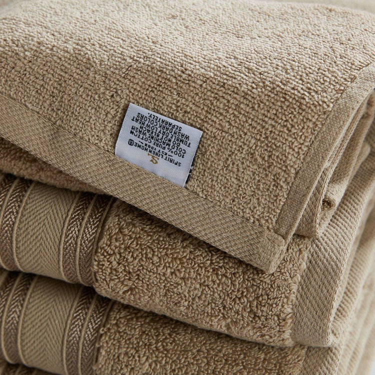 Stack of beige towels with a label on top