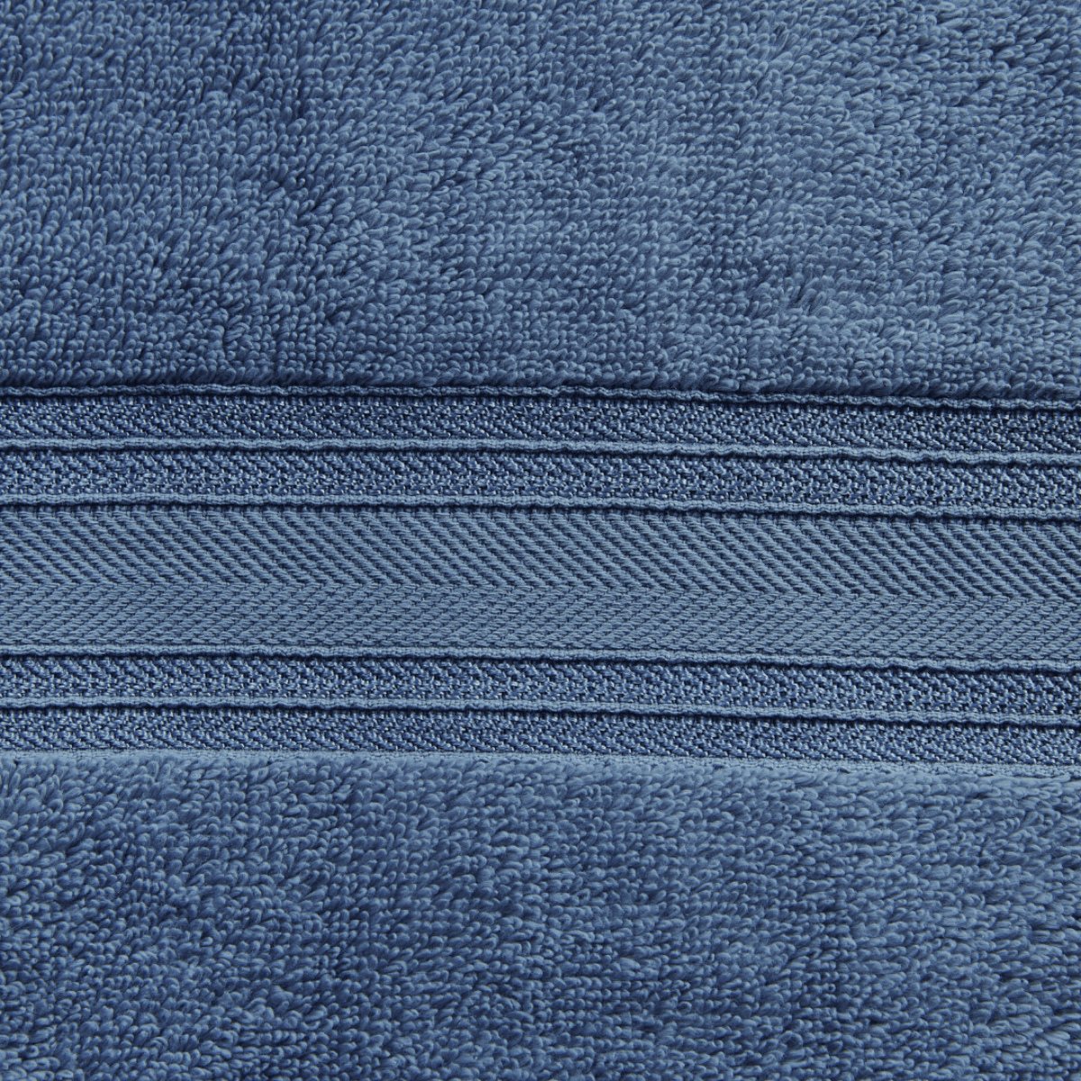 Close-up of blue fabric with a zipper