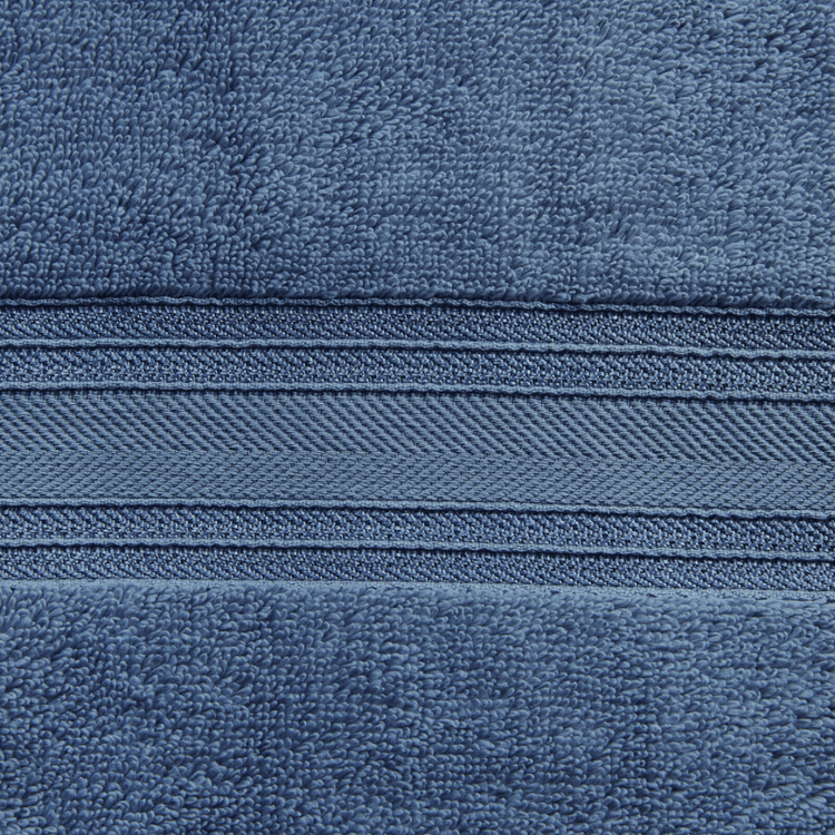 Close-up of blue fabric with a zipper