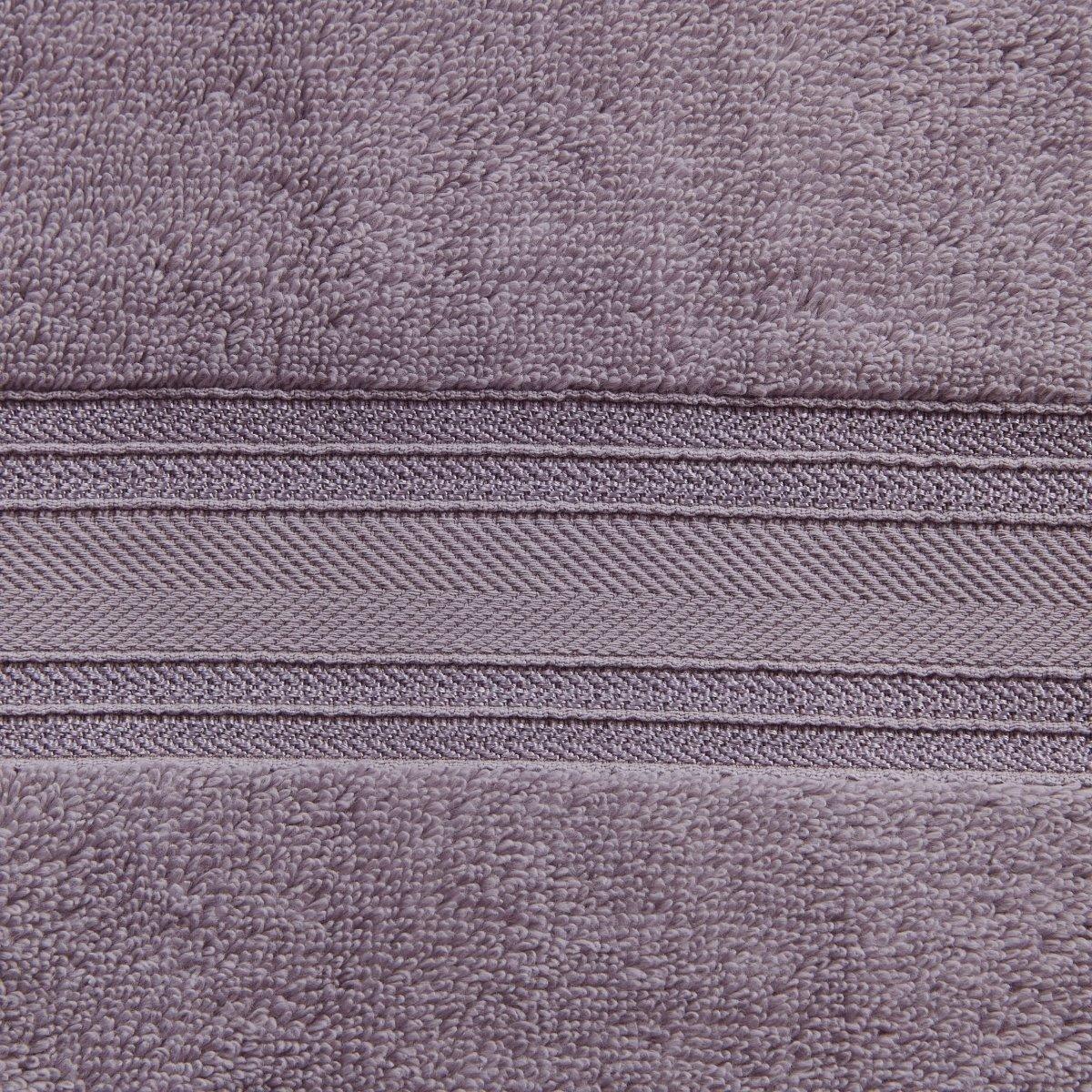 Close-up of a textured purple fabric with a zipper