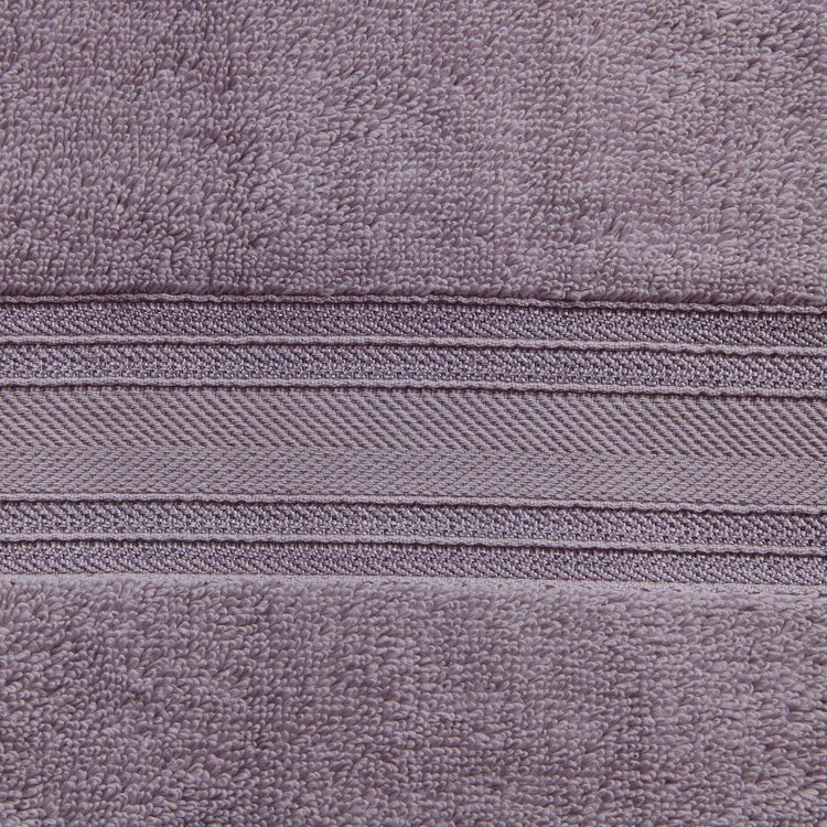 Close-up of a textured purple fabric with a zipper