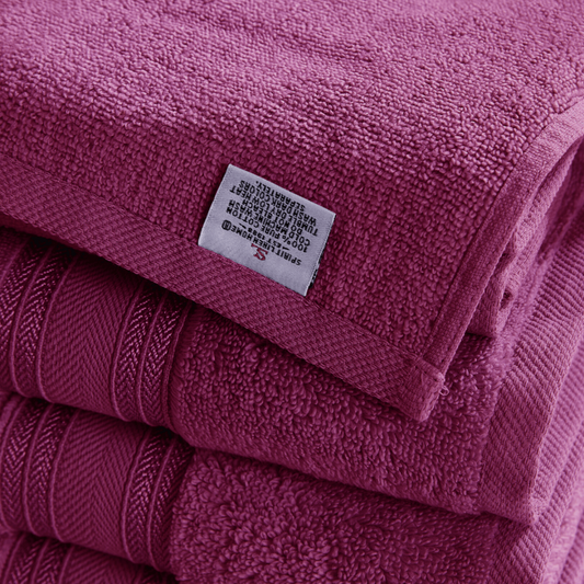 Stack of pink towels with a label on top