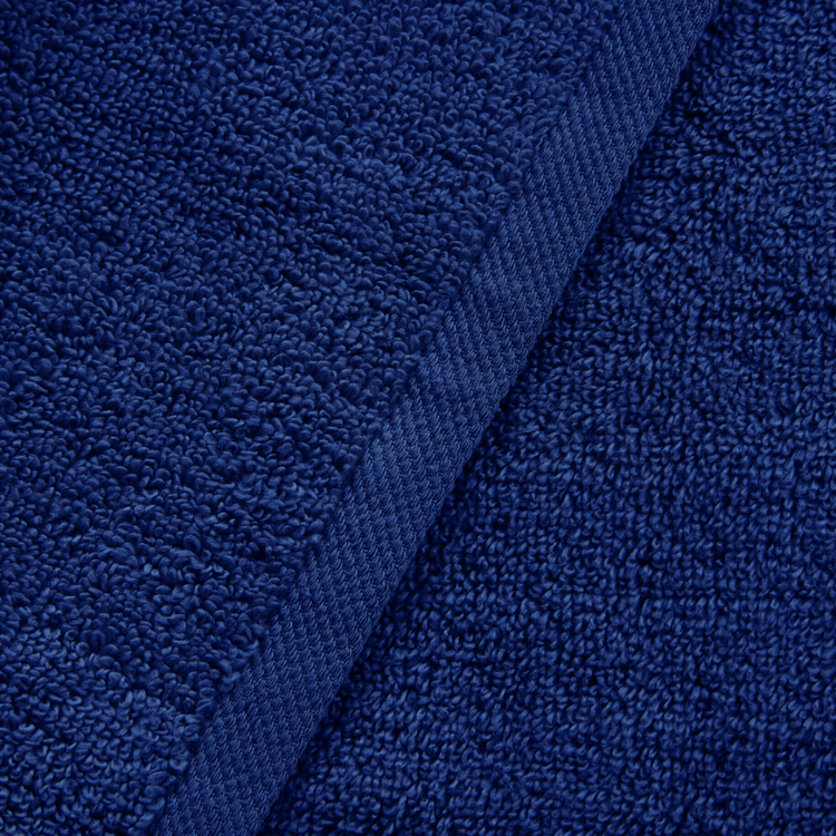 Close-up of blue textured fabric with a visible seam.