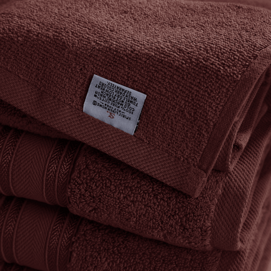 Stack of brown towels with a label on top