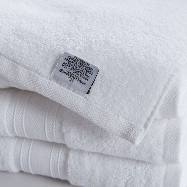 White towel with a label on a white background