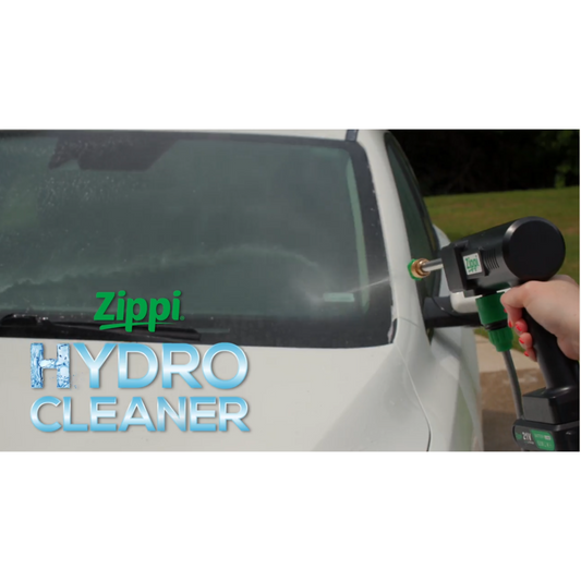 A Zippi Hydro Cleaner Deluxe with a black color scheme, including a gun handle, hose, nozzles, a carrying case, and other accessories.
