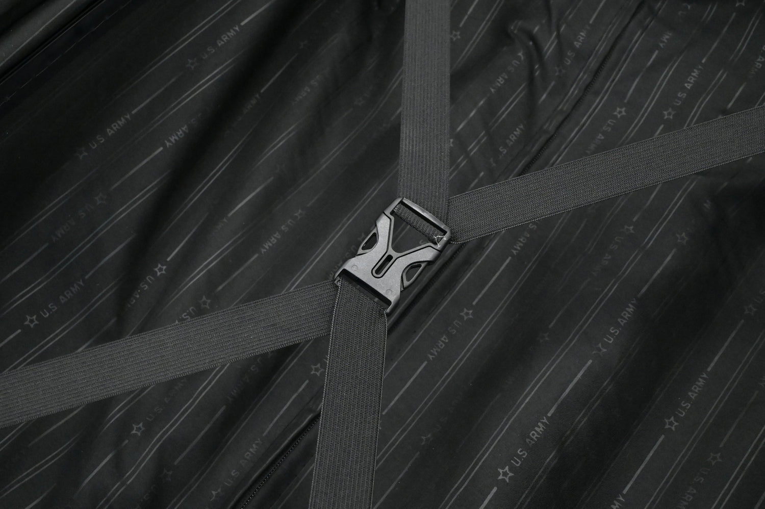 Close-up of a seat belt buckle on a textured black background