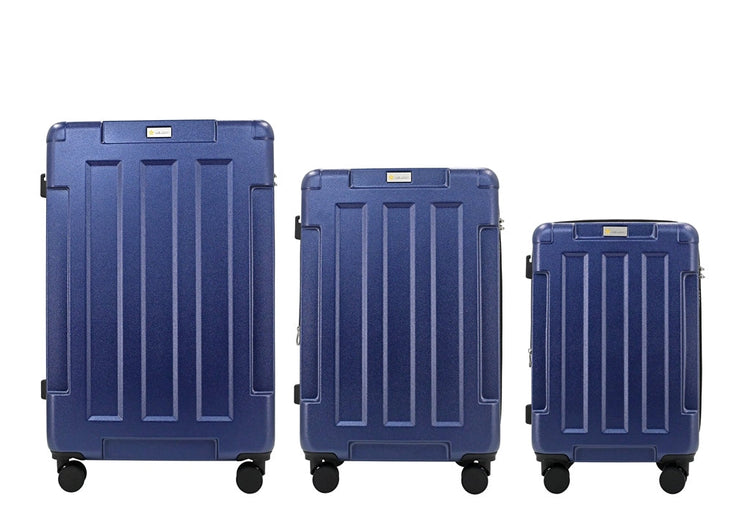 Three blue suitcases of different sizes on a white background