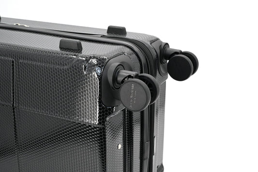 Set of black suitcases with wheels on a white background