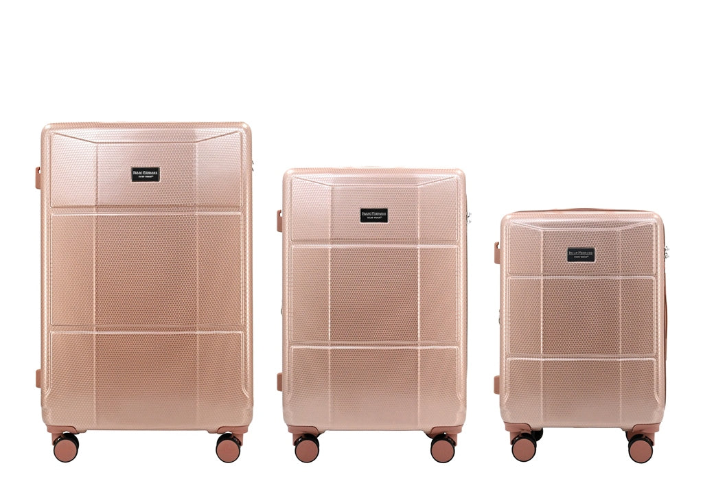 Three rose gold suitcases of different sizes on a white background