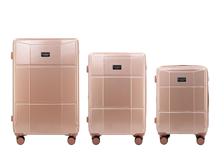 Three rose gold suitcases of different sizes on a white background