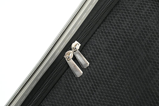 Set of black suitcases with wheels on a white background