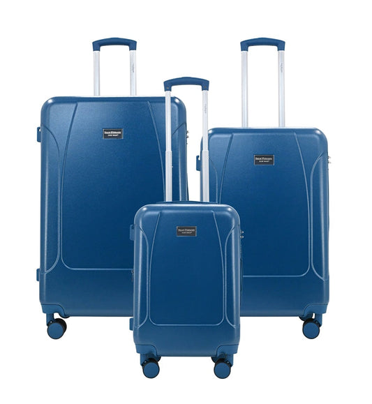Set of three blue suitcases with wheels on a white background