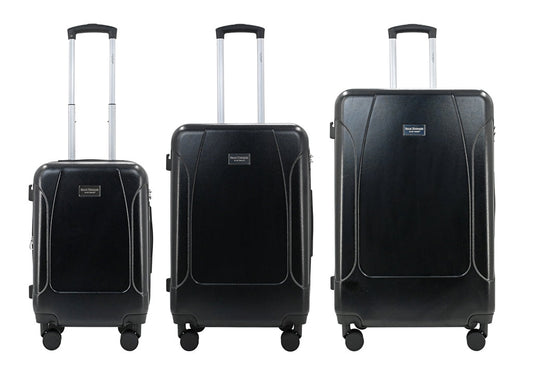 Set of three blue suitcases with wheels on a white background