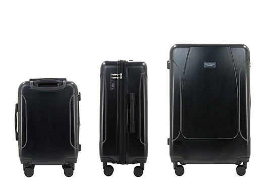Set of three blue suitcases with wheels on a white background