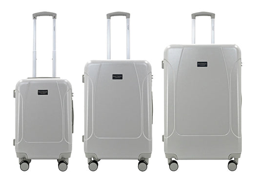 Set of three blue suitcases with wheels on a white background