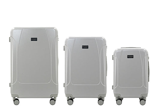 Set of three blue suitcases with wheels on a white background