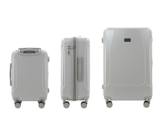 Set of three blue suitcases with wheels on a white background
