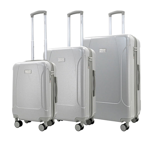 Set of three blue suitcases with wheels on a white background