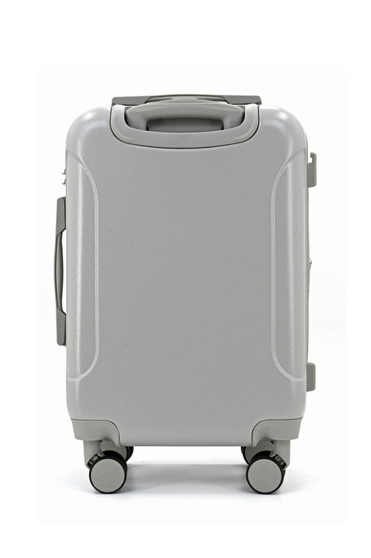 Set of three blue suitcases with wheels on a white background