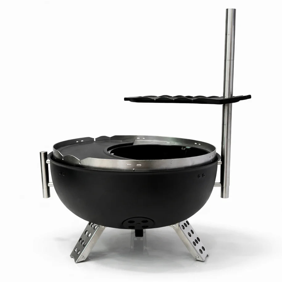 Black fire pit with metal stand and shelf on a white background