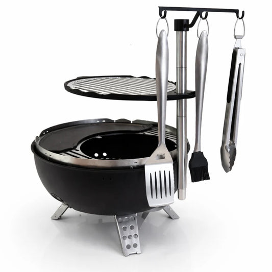 Black portable grill with cooking utensils on a white background