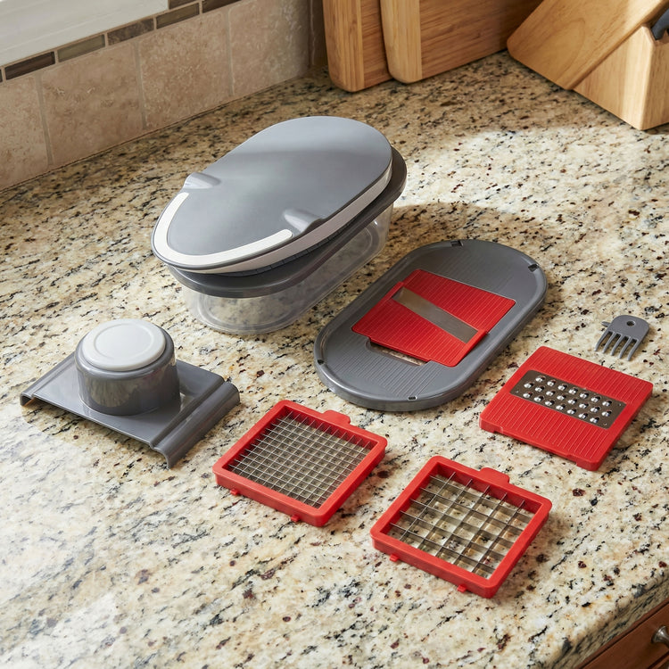 Kitchen chopper with interchangeable blades on a granite countertop