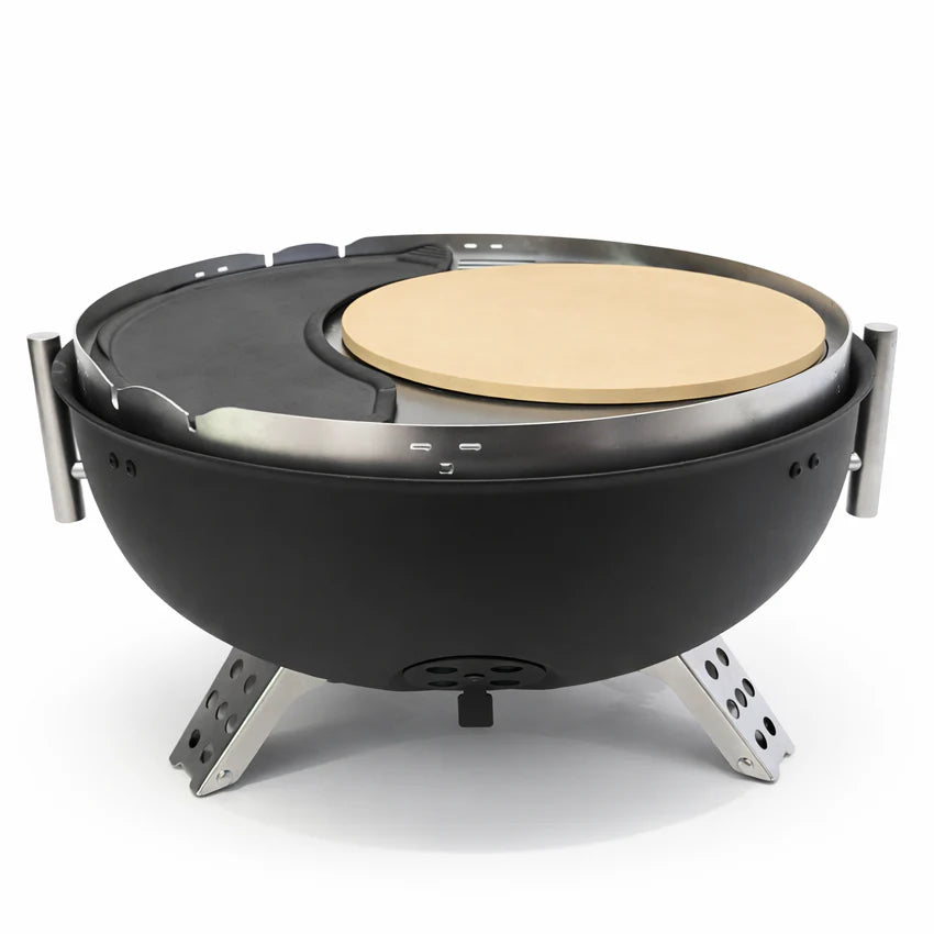 Portable outdoor grill with a pizza stone on a white background