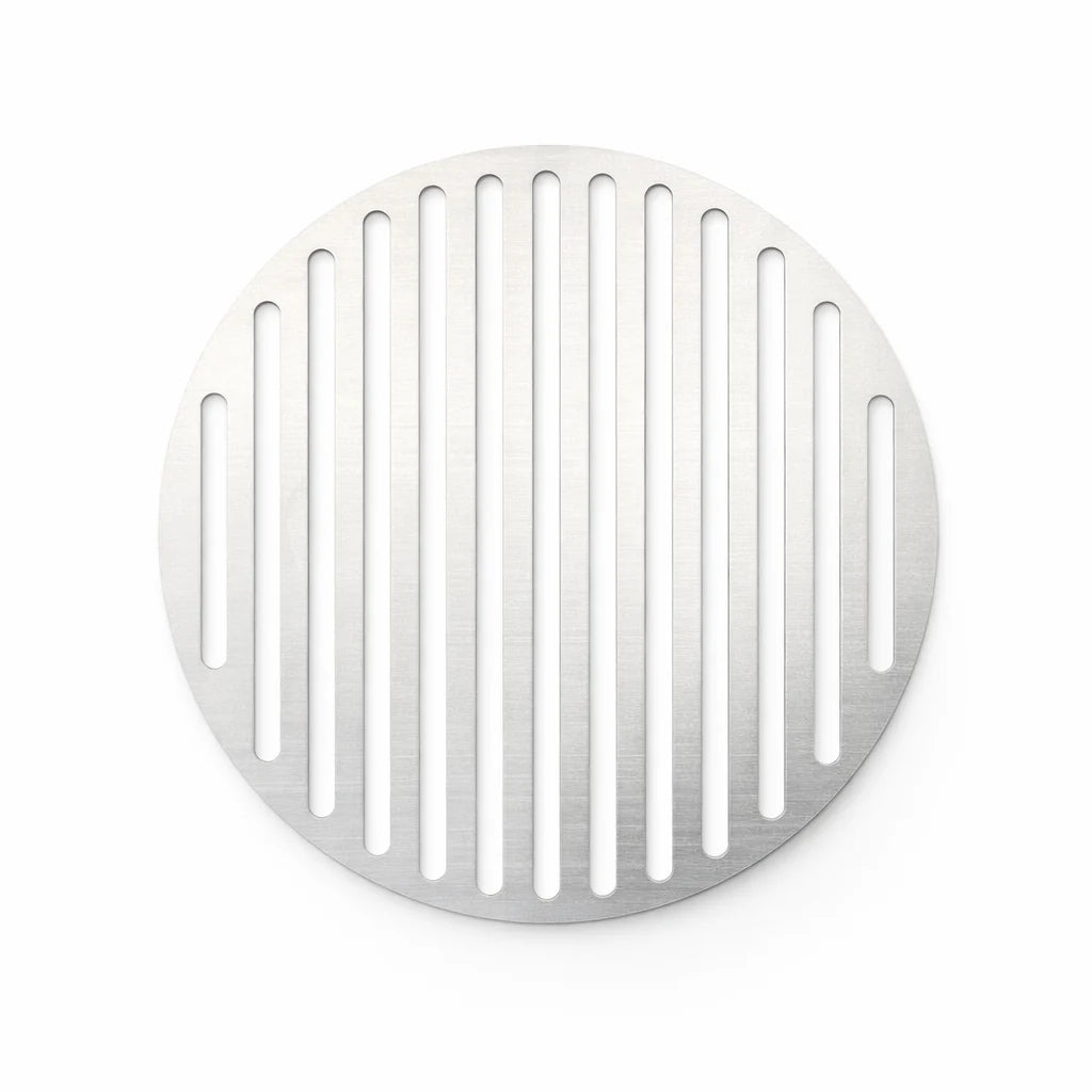Round metal drain cover with vertical slits on a white background