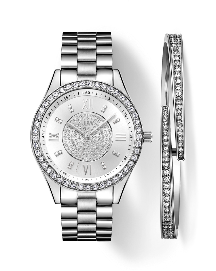 The JBW Mondrian | J6303-SetA features a silver diamond watch with a rhinestone-studded face, Roman numerals, and metal link band, paired with two matching silver crystal bangles. All items are displayed on a white background.