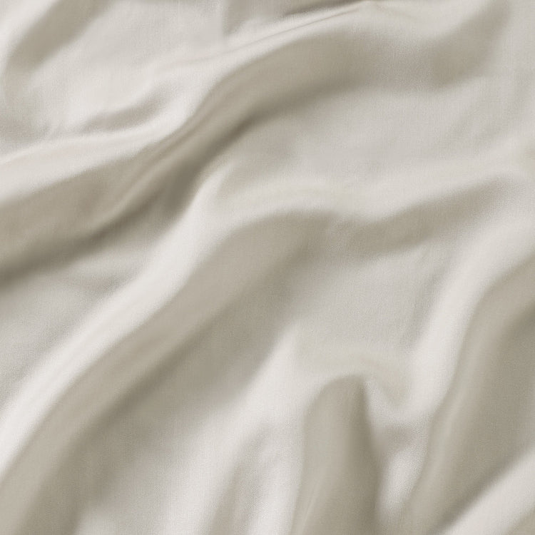 Close-up of beige fabric with soft folds