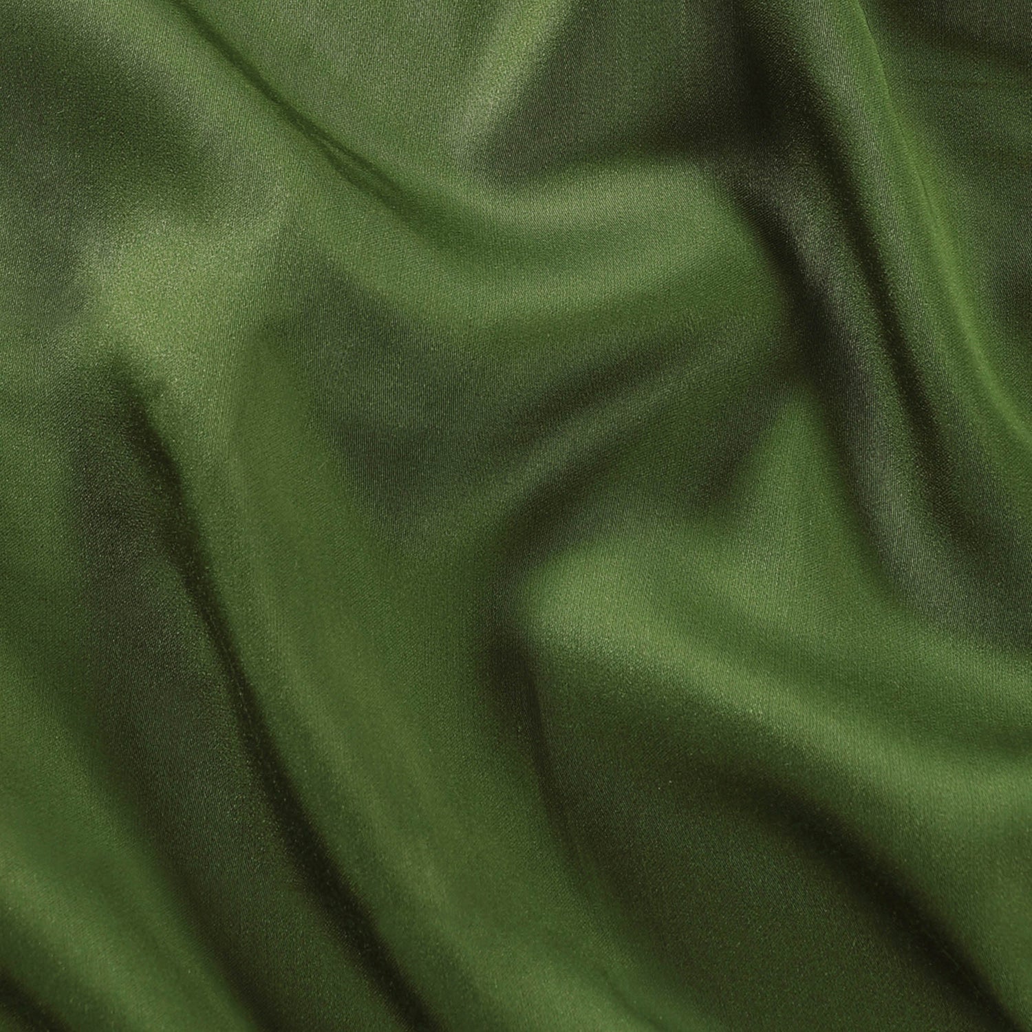 Close-up of green fabric with folds