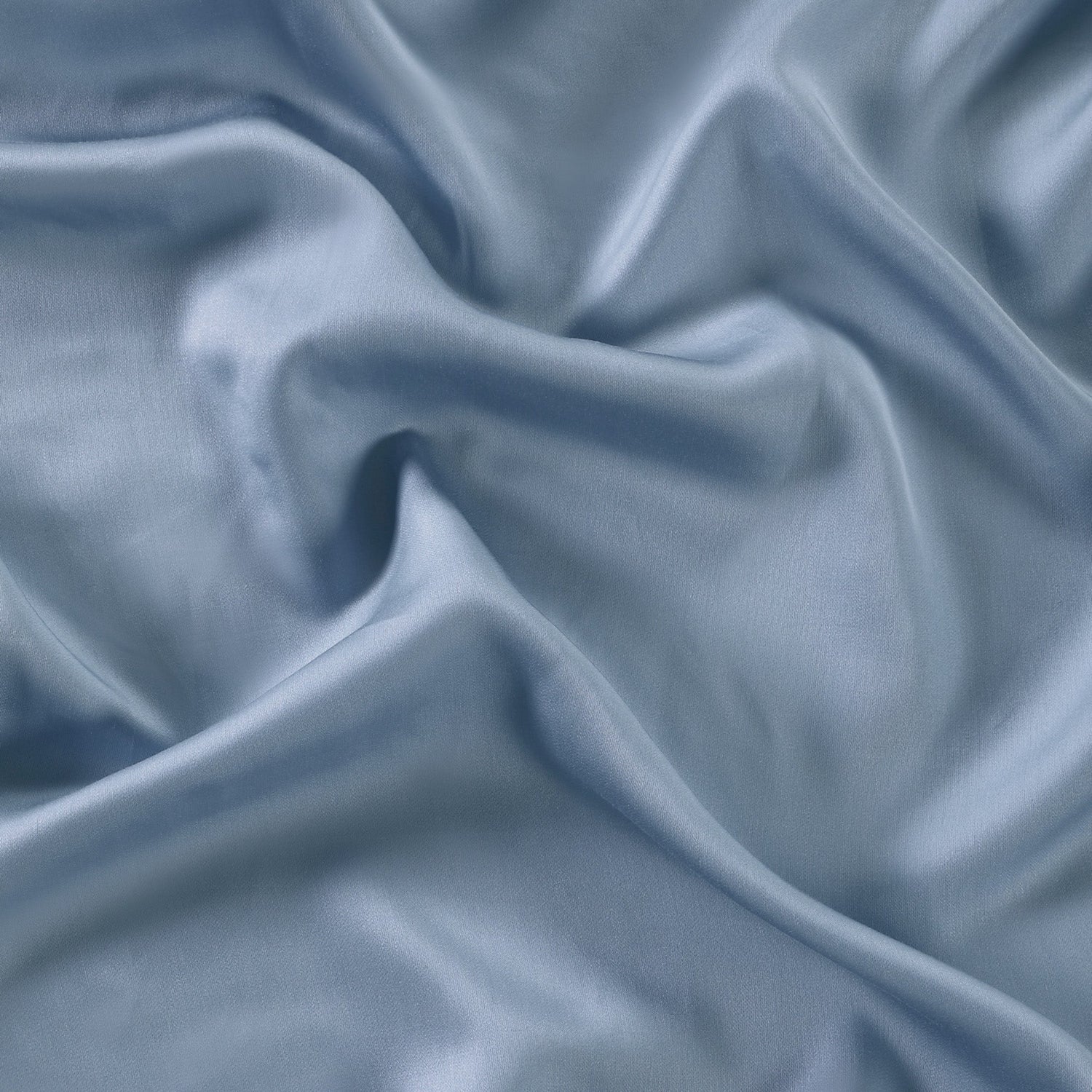 Close-up of blue fabric with folds