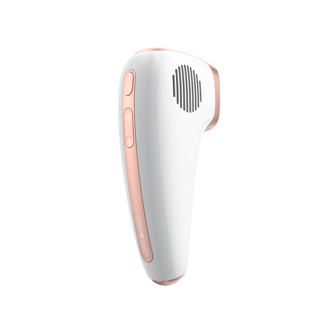 White and rose gold hair removal device on a white background