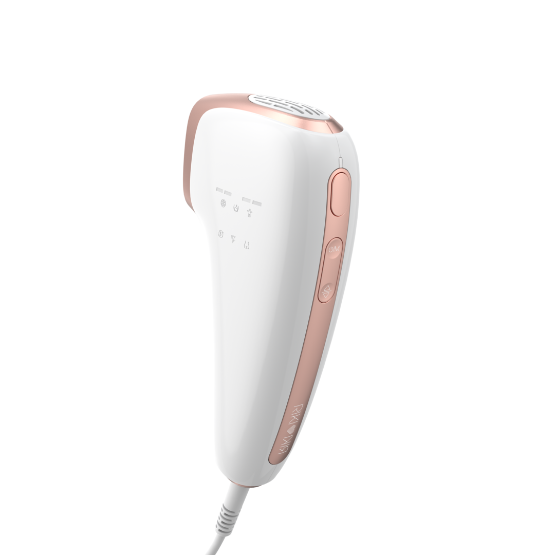 White and rose gold hair removal device on a white background