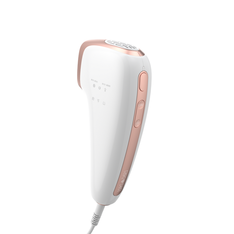 White and rose gold hair removal device on a white background