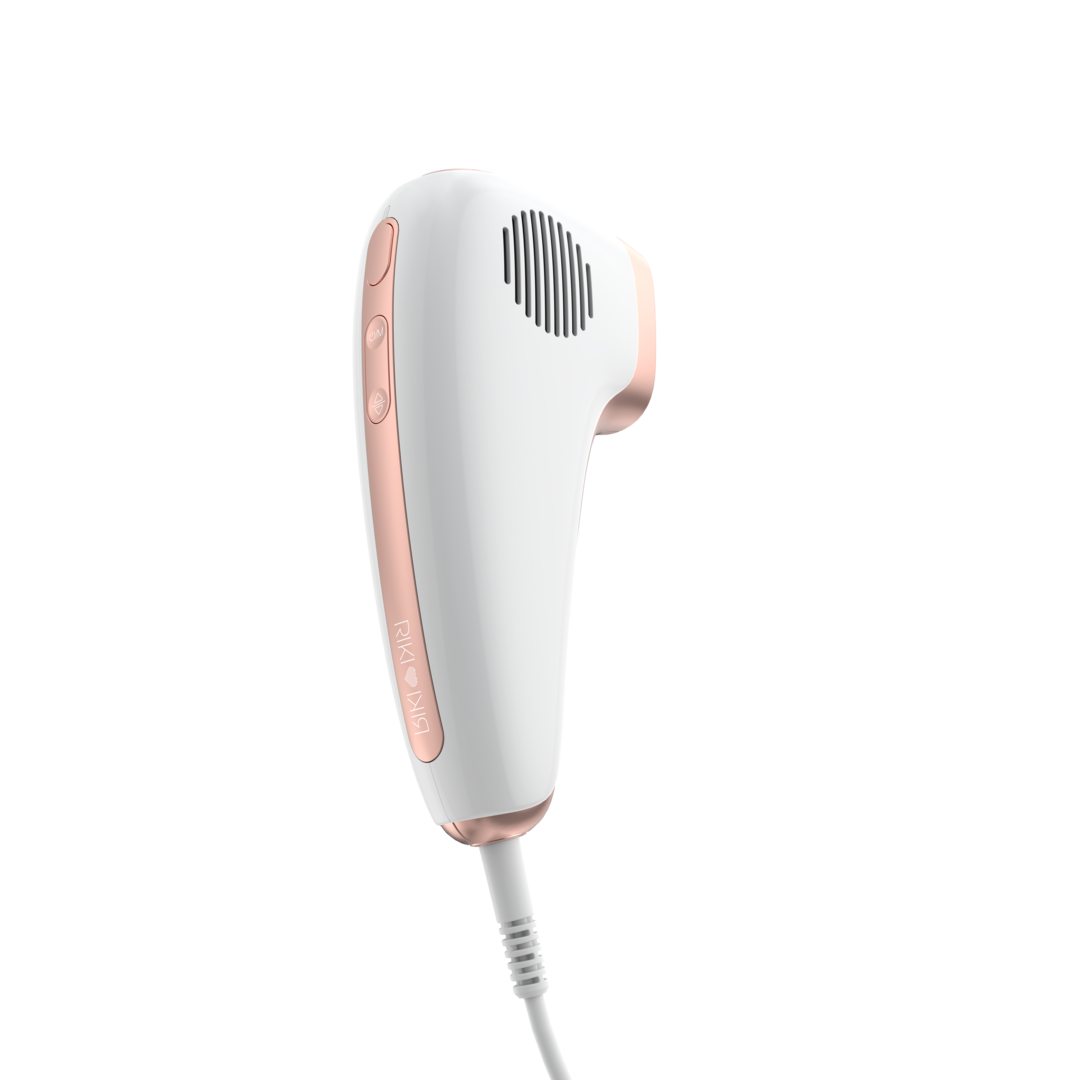 White and rose gold hair removal device on a white background